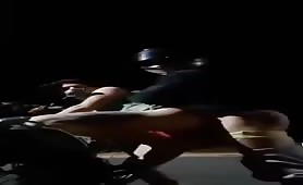 Fucking a stranger on a motorcycle in the middle of a public road