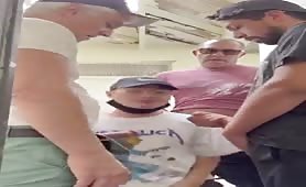 Horny young guy sucks a group of mature men's cock in a public bathroom